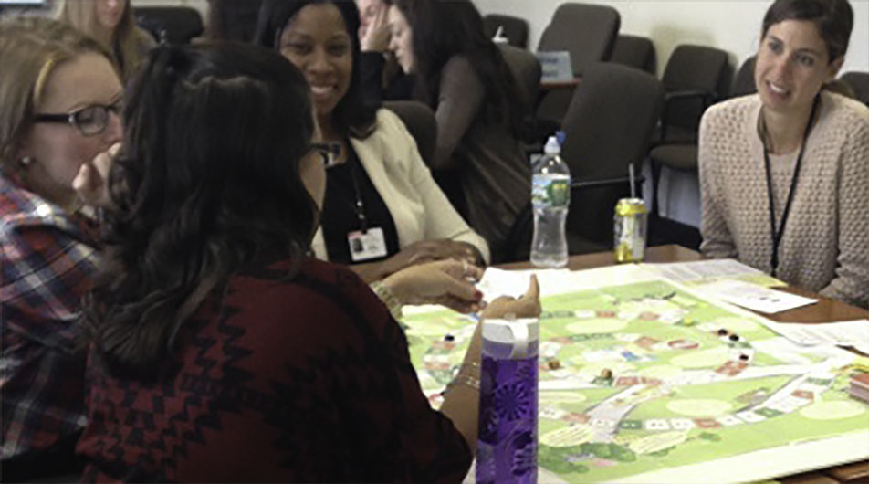 LEND trainees playing board game